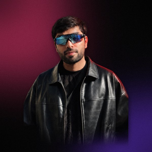 Claude Code, DJ, in a leather jacket and blue sunglasses